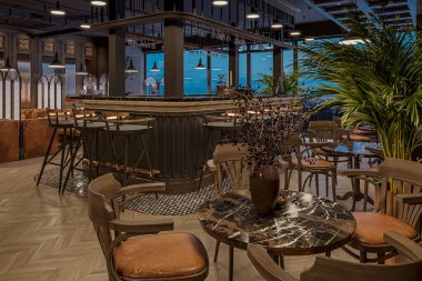 Şık yemekler, modern ambiyansı olan büyük lüks bir restoranda hazır masalar.