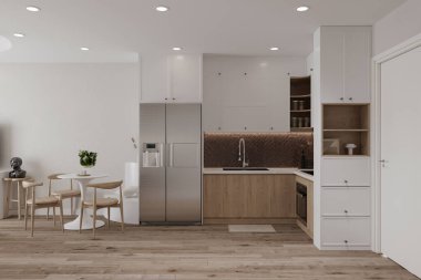 Yemekhanenin yanındaki dolaplı ve barlı mutfak.