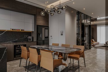 Geniş bir mutfak manzarası aile yemek masası, oturma odası ve modern bir evdeki aletler.