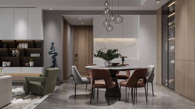 Yuvarlak bir masası, modern sandalyeleri ve avizesi olan zarif bir yemek odası..