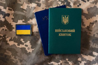 Ukrainian passport and military id identity citizenship doc with flag icon on pixel camouflage background clipart