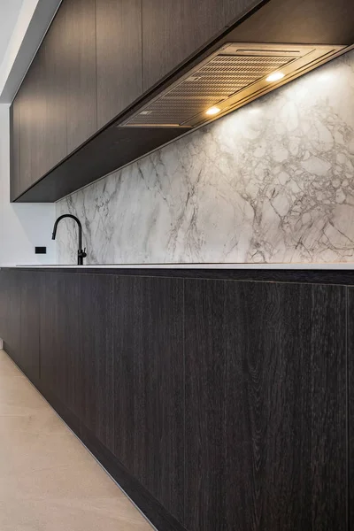 marble kitchen interior with black marble countertop