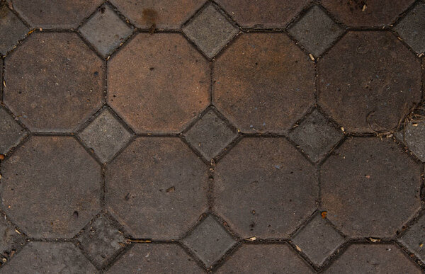 The cement floor and tiles have various cracks and scratches. Works well as a background image. It is an area with various and different patterns.