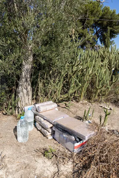 stock image A homeless man's bed in a vacant lot