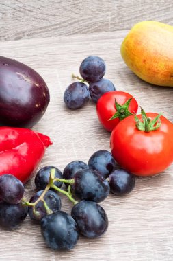 still life of organic fresh fruits and vegetables on wooden surface. Concept of healthy diet food. Place for logo or text