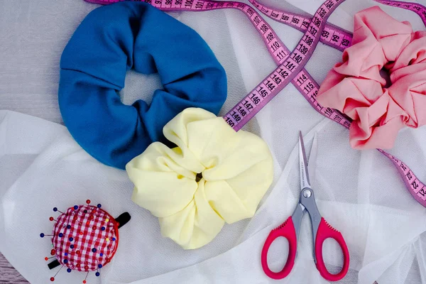 a top view of colorful sewing accessories and sewing items