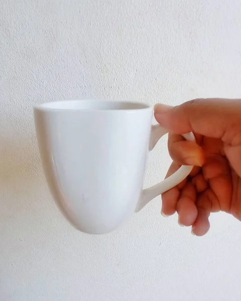 coffee or coffee cup with a hand