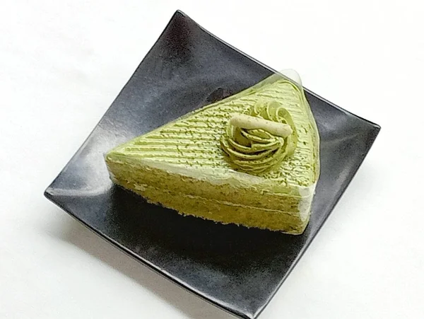 Green Tea Cake Topped Price Whipped Cream Black Plate White — Stock Photo, Image