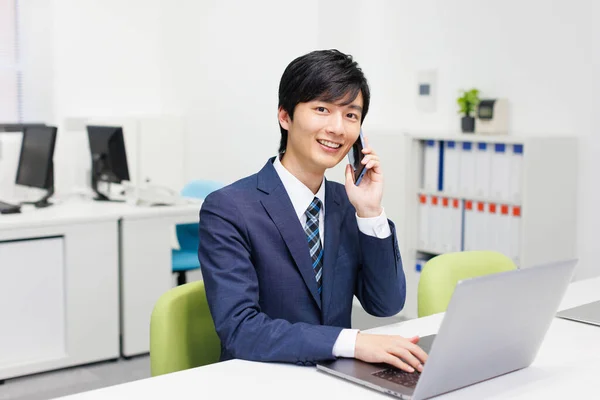 Young Japanese Businessman Talking Phone While Working Office — Stock Photo, Image