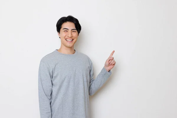 Junger Asiatischer Mann Zeigt Mit Finger Auf Isolierten Hintergrund — Stockfoto