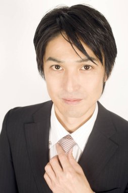 Yakışıklı Asyalı iş adamının portresini yakından çek.