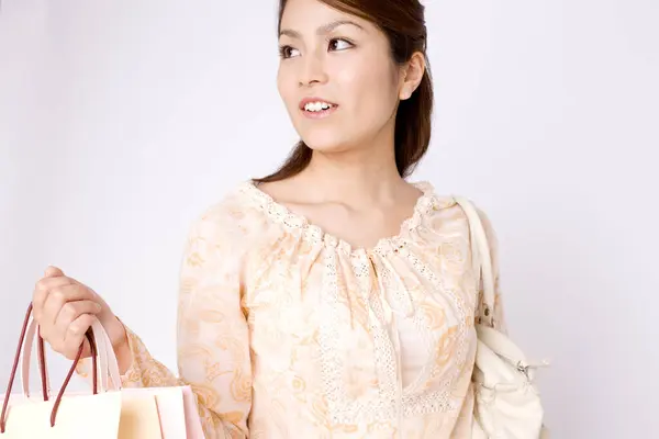 Hermosa Joven Asiática Mujer Con Bolsas Compras Aislado Fondo —  Fotos de Stock