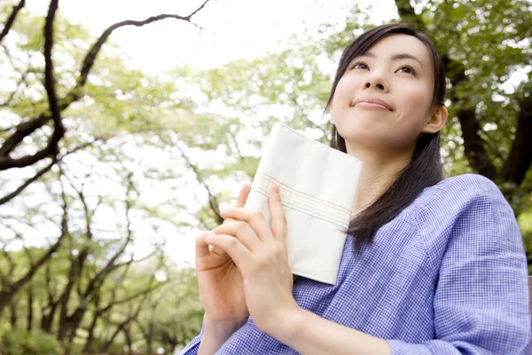 Cheerful Japanese Woman Reading Book Green Summer Park Daytime — Stock Photo, Image