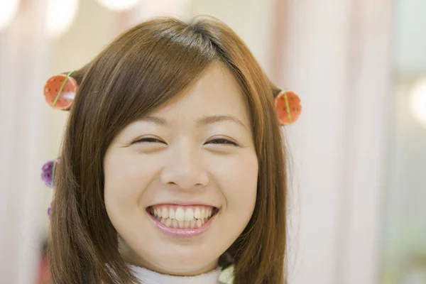 Young Japanese woman doing hairdressing in salon. Beauty Japanese lady making stylish haircut