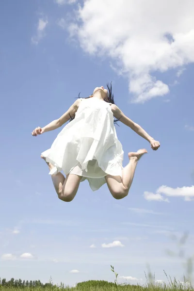 Low Angle View Beautiful Young Woman White Dress Jumping Outdoors — Stock Photo, Image