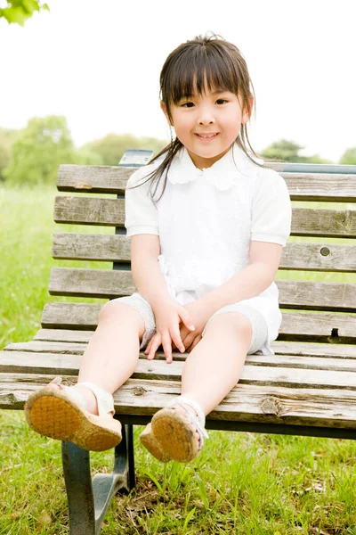 Portrait Cute Little Asian Girl Sitting Bench Summer Park — Stock Photo, Image