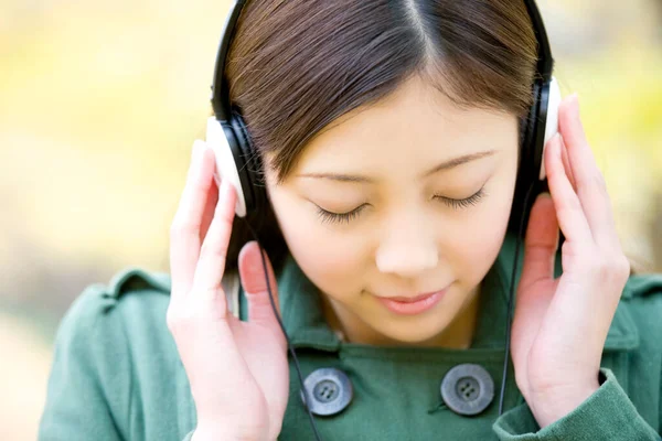 Young Japanese Woman Headphones Park Royalty Free Stock Photos