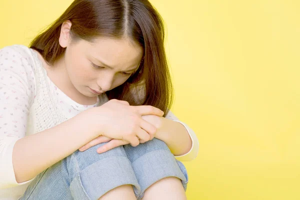 Young Asian Sad Woman Isolated Yellow Background — Stock Photo, Image