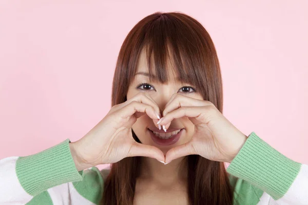 Young Beautiful Asian Woman Showing Heart Gesture Isolated Background — Stock Photo, Image