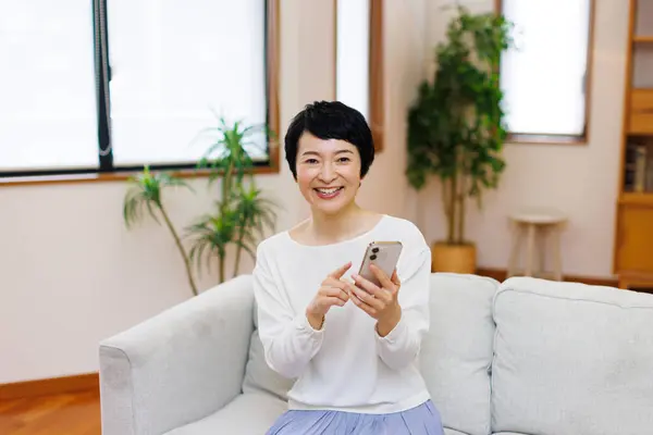 Asian Senior Woman Using Smart Phone Home — Stock Photo, Image