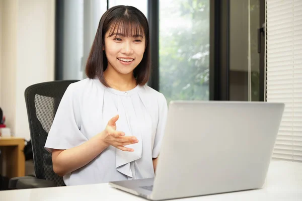 Portrait of beauty businesswoman in office. Young Japanese woman at work