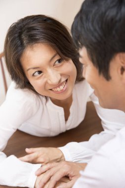 couple sitting  at table at home 