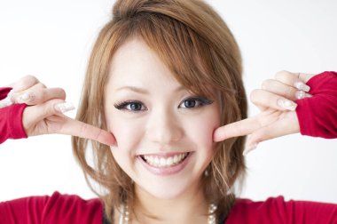 young woman pointing her cheeks 