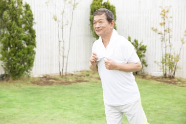 asian senior old man with towel after training 