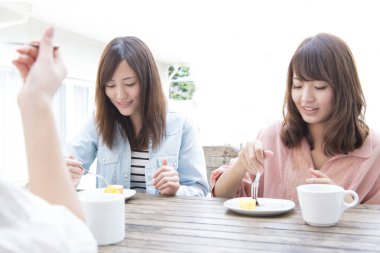 asian friends having  lunch in cafe 