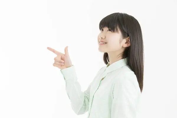 Young Asian Girl Student Pointing Finger Isolated White Background — Stock Photo, Image