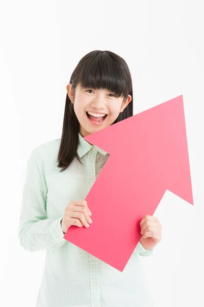 Jovem Asiático Menina Estudante Mostrando Vermelho Seta Sinal Isolado Branco — Fotografia de Stock