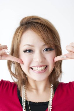 woman smiling showing her cheeks 