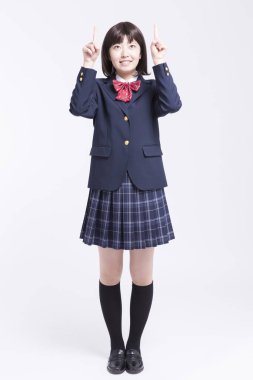 Gülümseyen Asyalı kız öğrencinin portresi