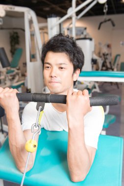 young man working out in the fitness center