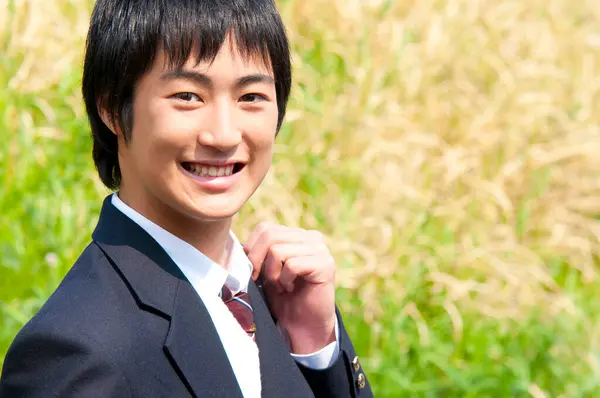 Stock image portrait of a young man in park