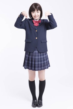 Gülümseyen Asyalı kız öğrencinin portresi