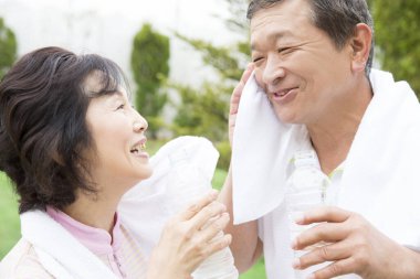 senior couple drinking juice in the morning