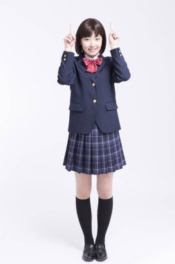 Gülümseyen Asyalı kız öğrencinin portresi