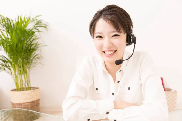 asian customer service operator in headset