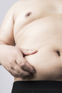 Koca göbekli şişman bir adam. Şişman adam. Stüdyo resmi