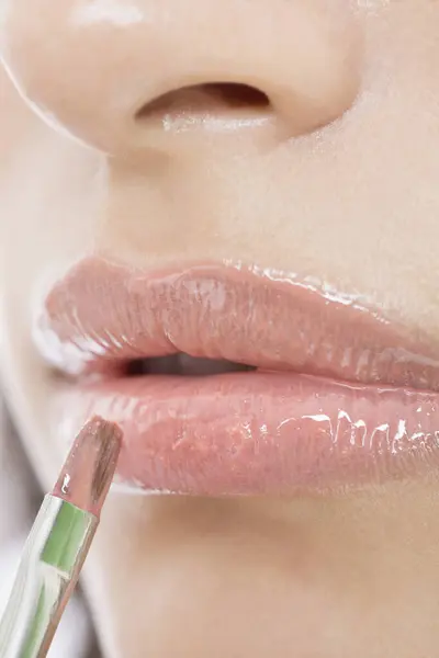 Close Young Woman Applying Lip Gloss Lips — Stock Photo, Image