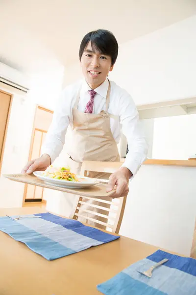 Smiling Asian Man Carrying Meal Tray Royalty Free Stock Photos
