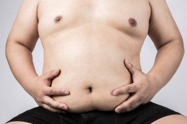 Koca göbekli şişman bir adam. Şişman adam. Stüdyo resmi