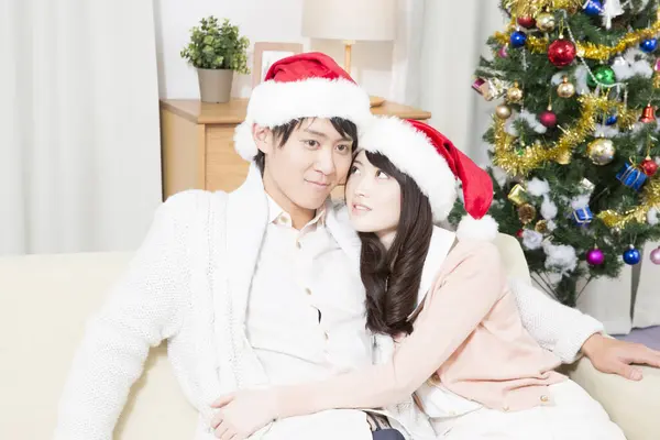 Asian Couple Wearing Santa Hats Celebrating New Year Home — Stock Photo, Image