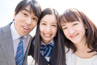 smiling young business people looking at camera