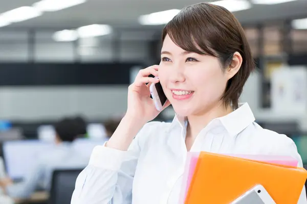 Asian Businesswoman Talking Smartphone Office Stock Image
