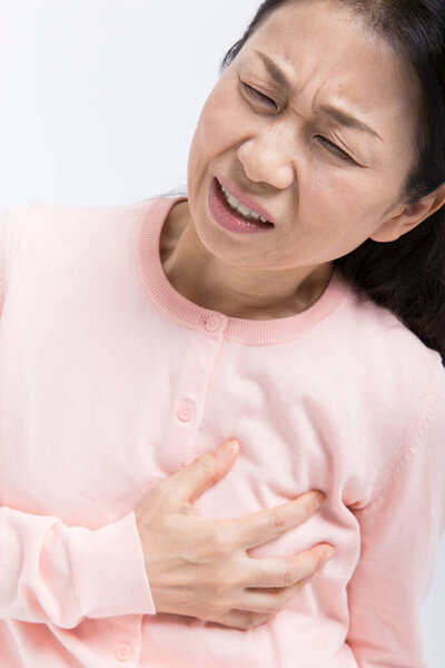 senior asian woman has pain in chest, heart attack, isolated on white 