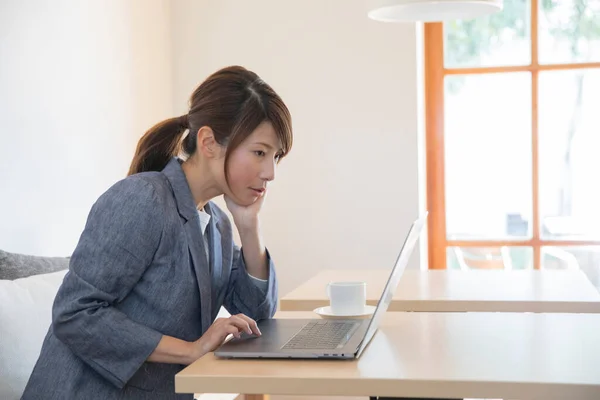 young woman working with laptop in the office