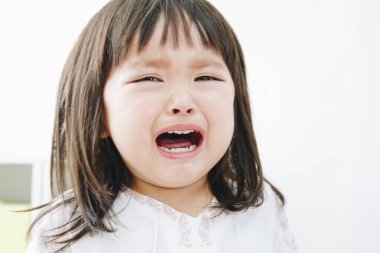 asian unhappy girl crying in the room