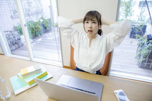 woman with headache and stress in office